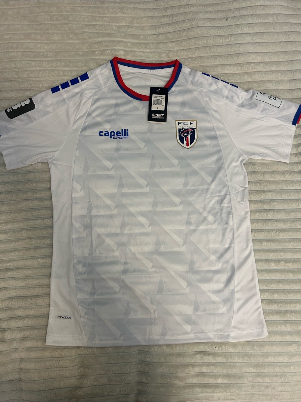 Capelli of New York White Soccer Jersey with Blue and Red Trim